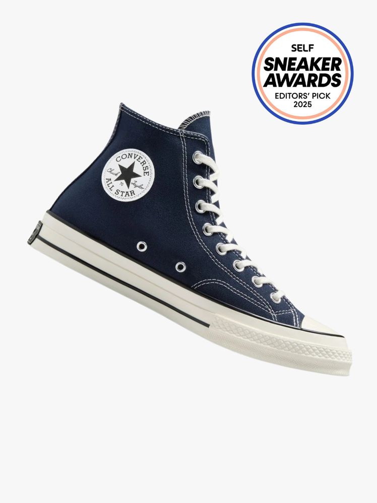 Converse Chuck 70 high top sneaker in navy blue canvas. The SELF Sneaker Awards seal is in the top right corner.