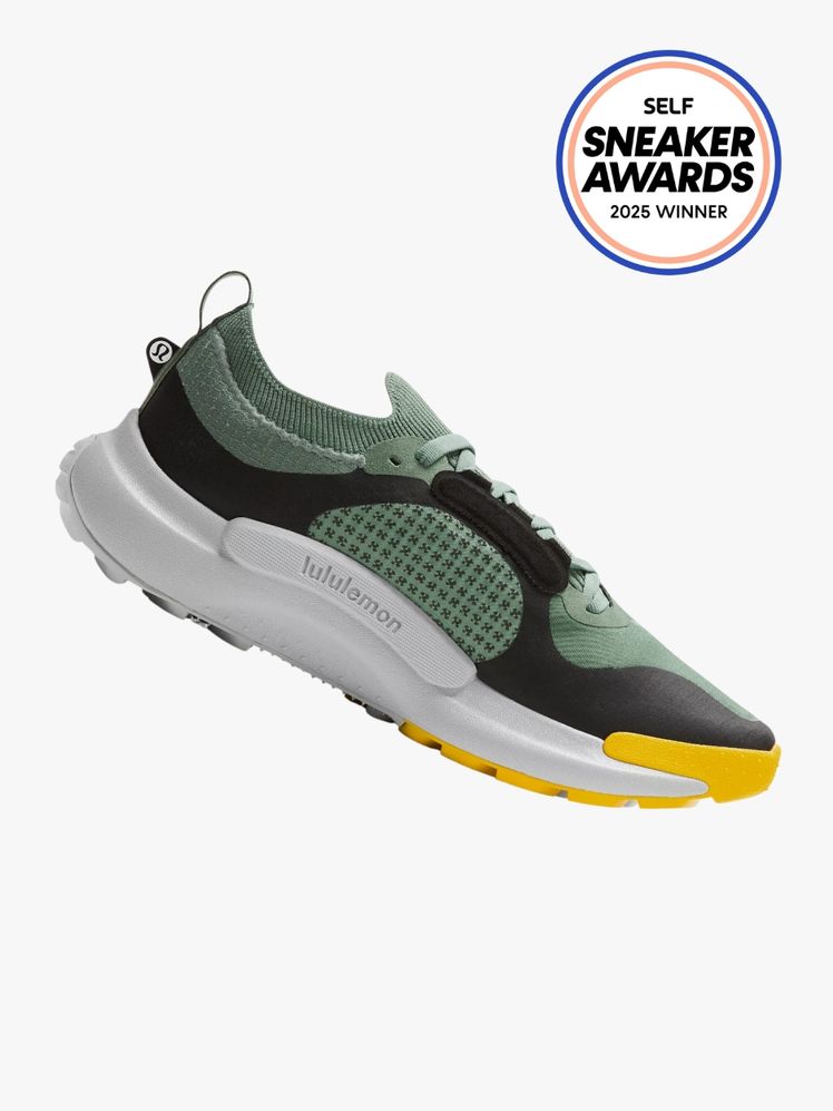 Lululemon Wildfeel Trail Running sneaker in green black and yellow. The SELF Sneaker Awards seal is in the top right corner.