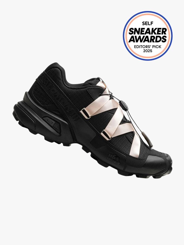 Salomon x Sandy Liang Speedcross 3 Ribbon shoe in black with light pink ribbon. The SELF Sneaker Awards seal is in the...