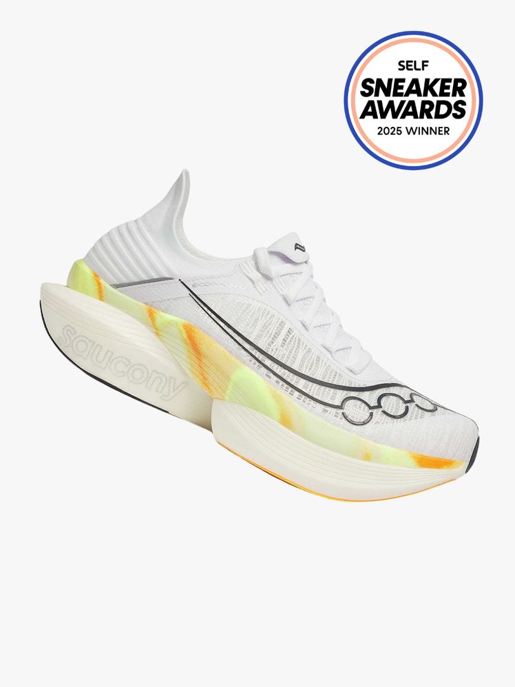 Saucony Endorphin Elite 2 white sneakers with neon stripe on light gray background with SELF Sneaker Awards seal in the...