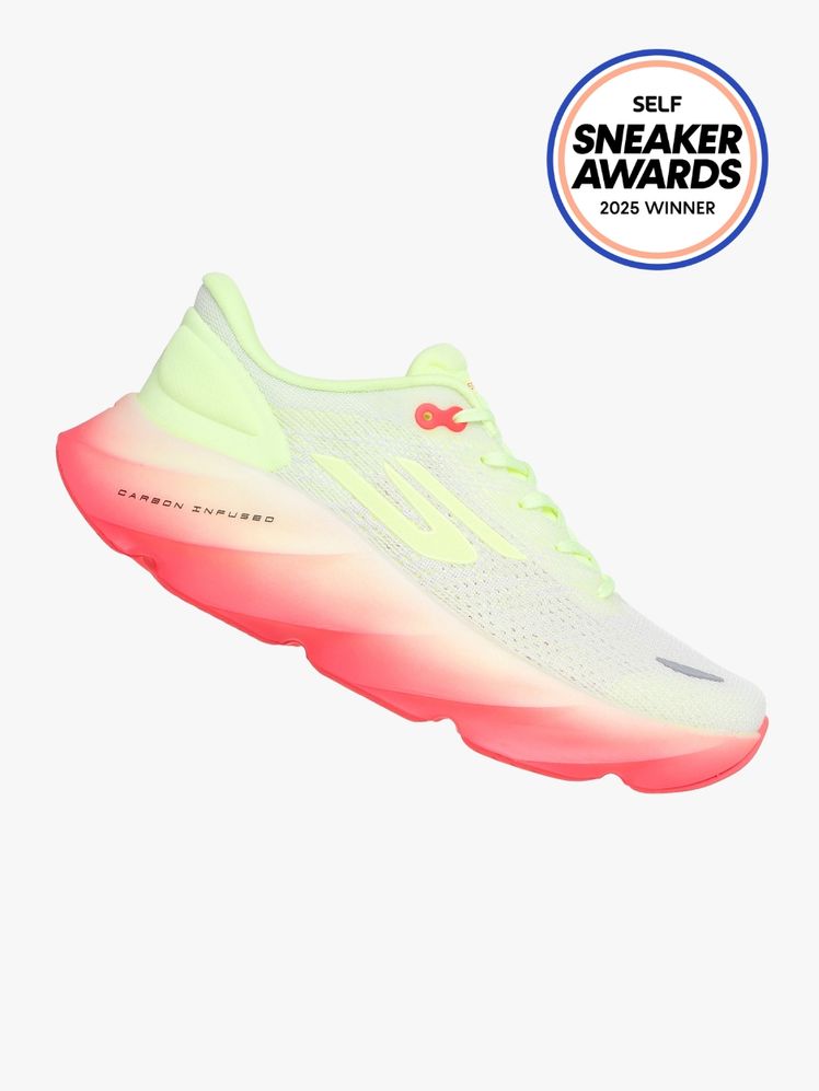 Sketchers Aero Burst sneaker in neon yellow and white with a pink ombre cushioned sole. The SELF Sneaker Awards seal is...